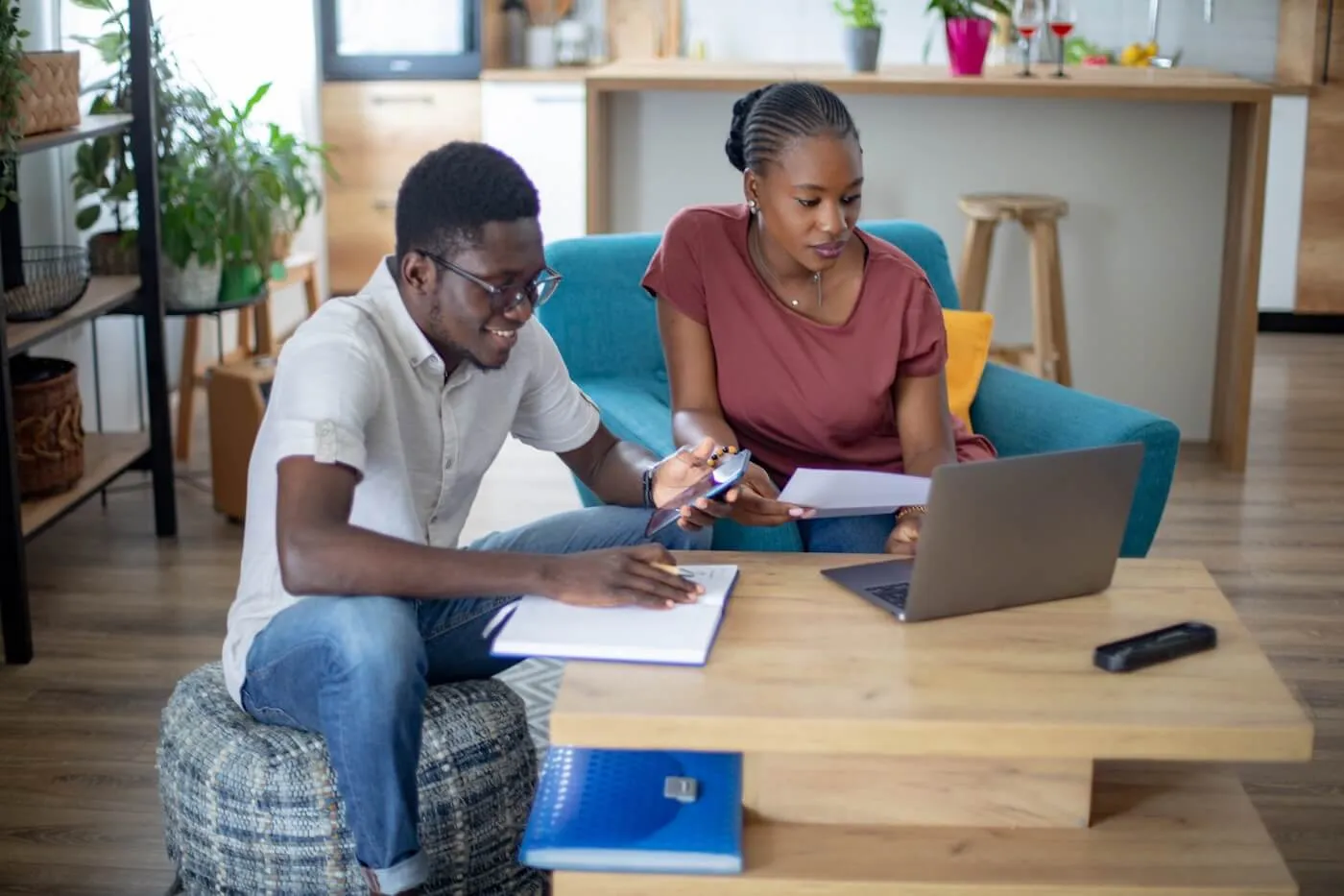 Focused couple planning their finances online in the living room