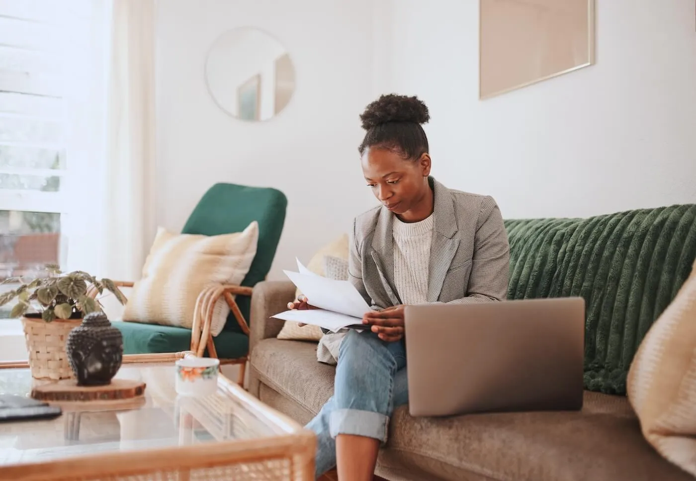 Focused woman filing taxes online from home