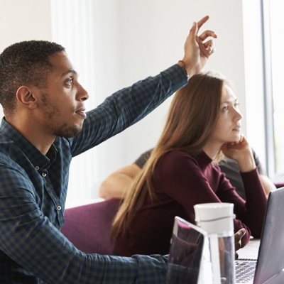 Person raising hand to ask a question.