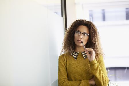 woman contemplating proof of income letter or income verification letter best practices