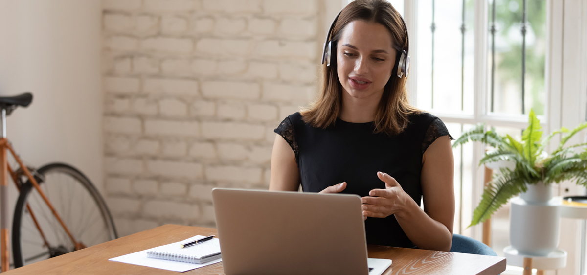 woman taking part in training on her laptop