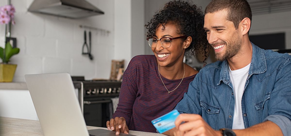 people paying on credit while on laptop