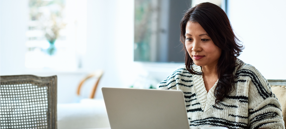 Woman car shopping on laptop