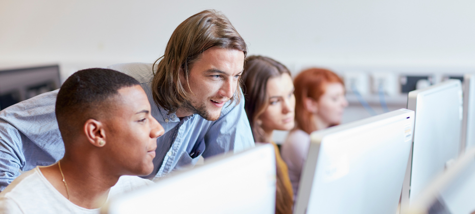 Office workers talking in front of computer