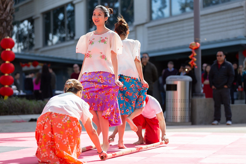 Dancers perform the Filipino folk dance, Tinikling