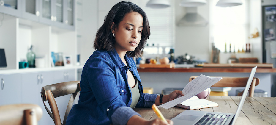 Young woman using a laptop and working from home