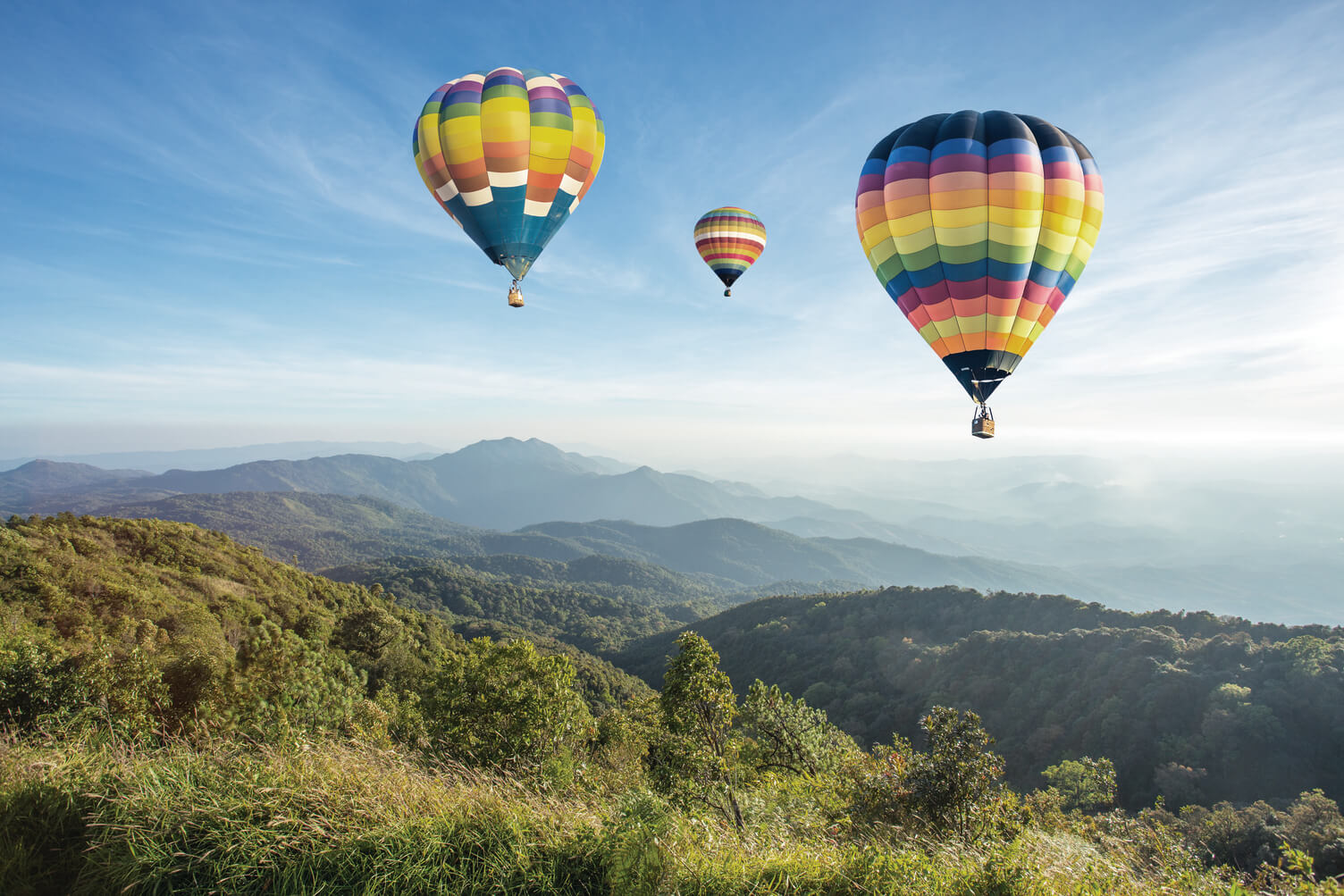 air balloons over mountains