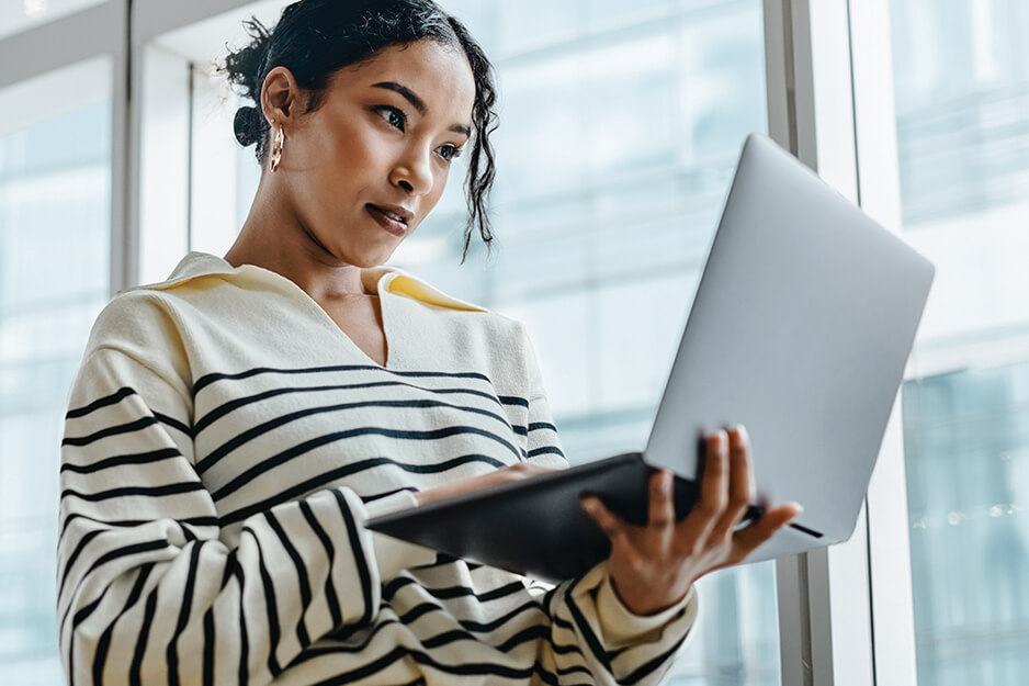 Two colleague discussing work on computer screen