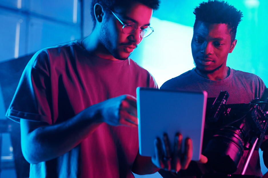 Two guys looking at an iPad