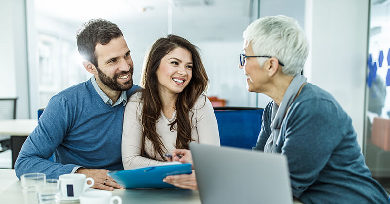 couple meeting with credit union representative 