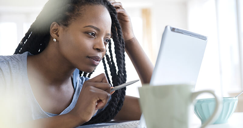 woman working on tablet at home