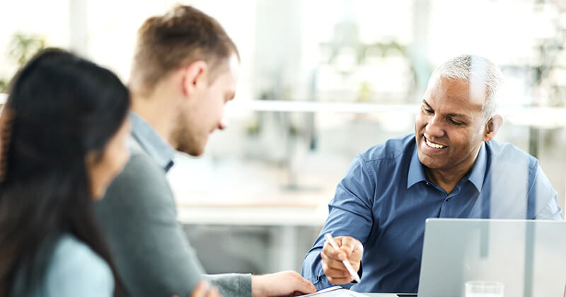 Credit union employee working with clients