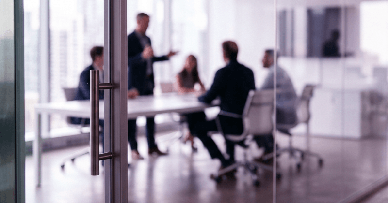 Meeting room with people talking