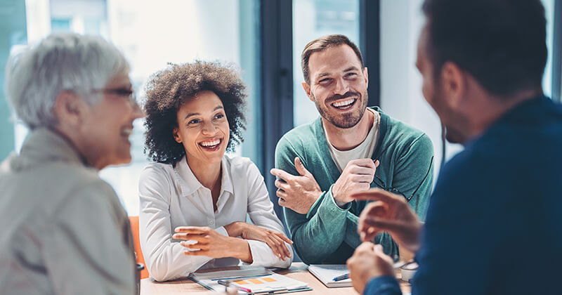 Four business people in meeting room