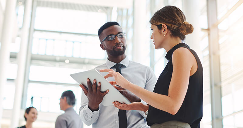 Business colleagues having conversation in office