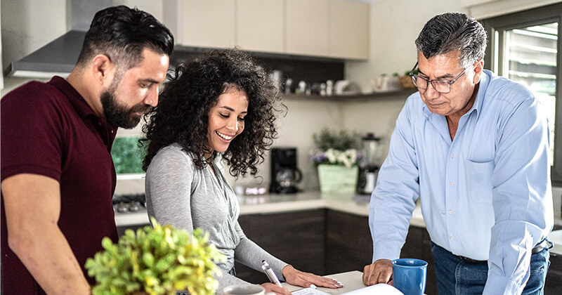 man and woman filling out rental application in kitchen