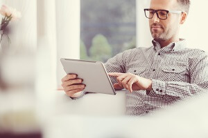 Businessperson writing with pen on paper