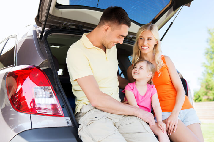 image of family in back of automobile