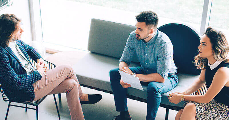 Businessman discussing with colleagues