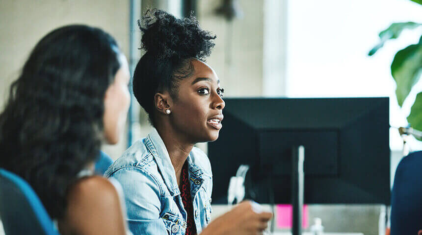 Businesswoman in discussion with coworker