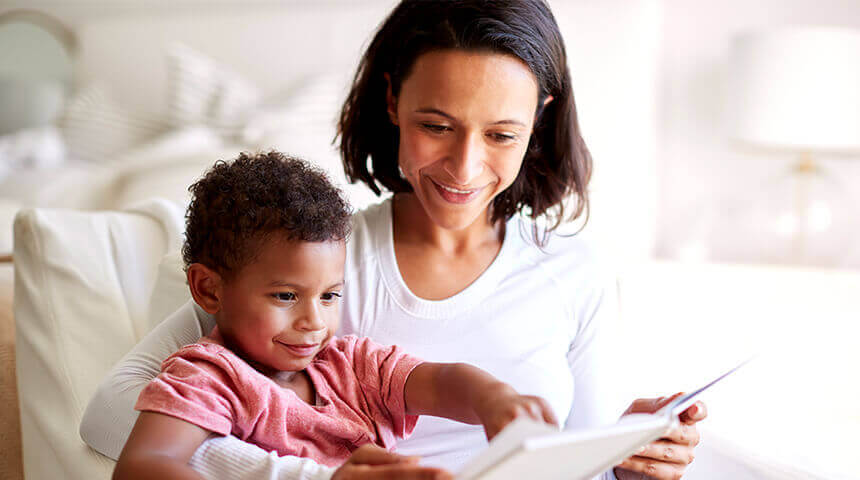 Close up of young mother sitting with child