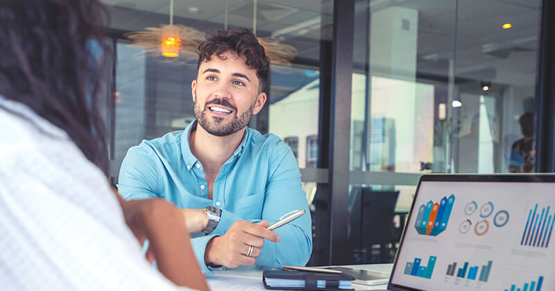 colleagues-having-conversation-office