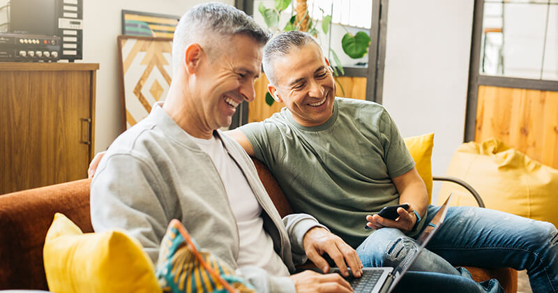 couple-on-couch-going-over-home-finances