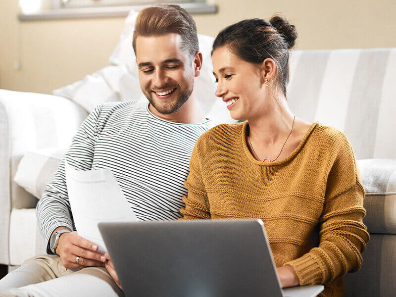 couple checking email on laptop