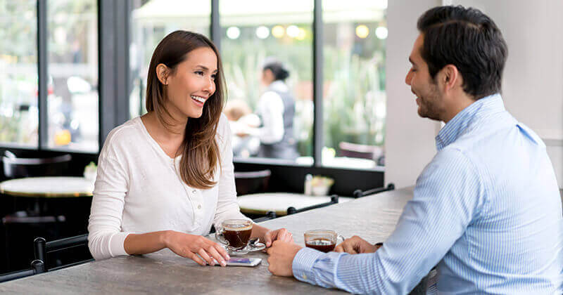 Couple having coffee at cafe