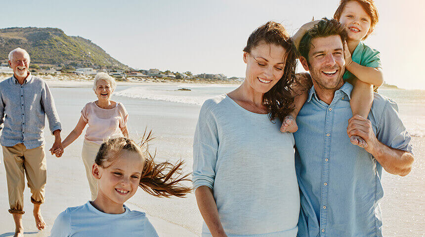 Family strolling on the beach