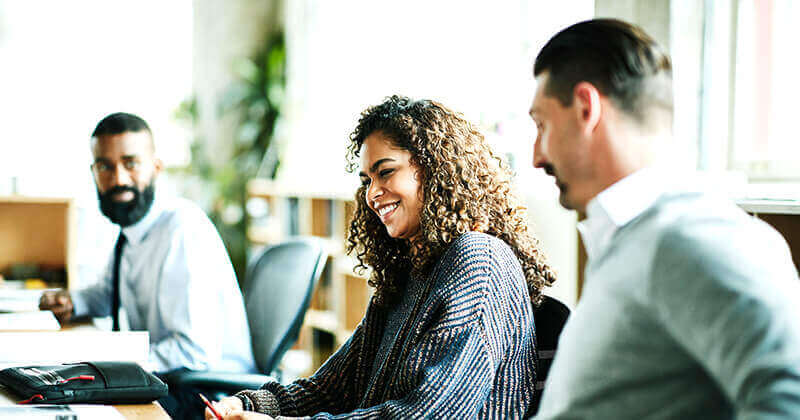 Laughing coworkers in discussion