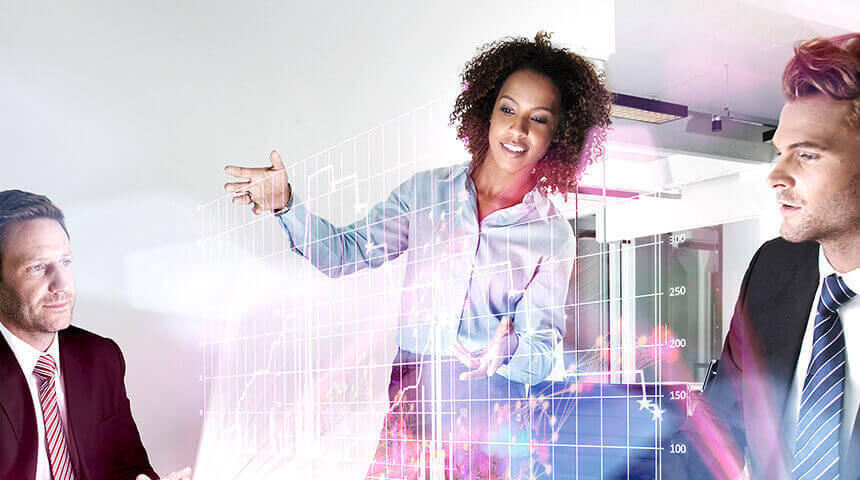 Young black woman in business apparel, raising her arms to show her two white male colleagues a digital, pink, holographic graph.