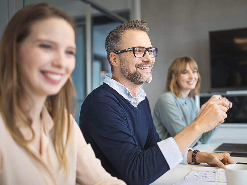 Professionals working together in office