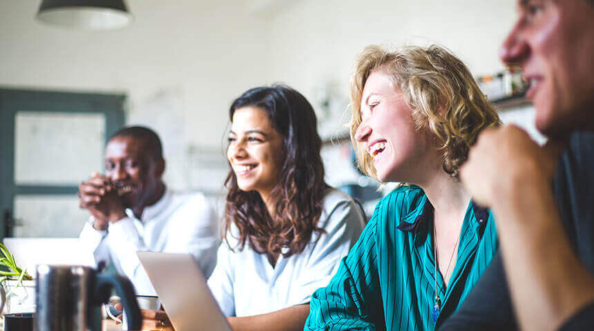 Smiling professionals looking away sitting