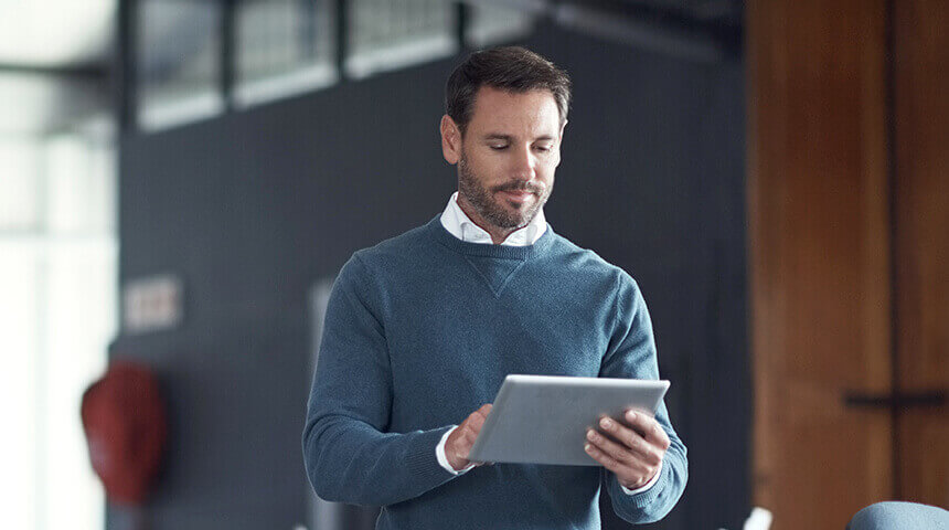 businessman looking at tablet