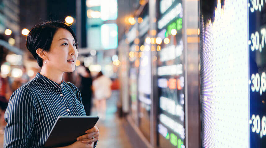 Women looking at stock market data