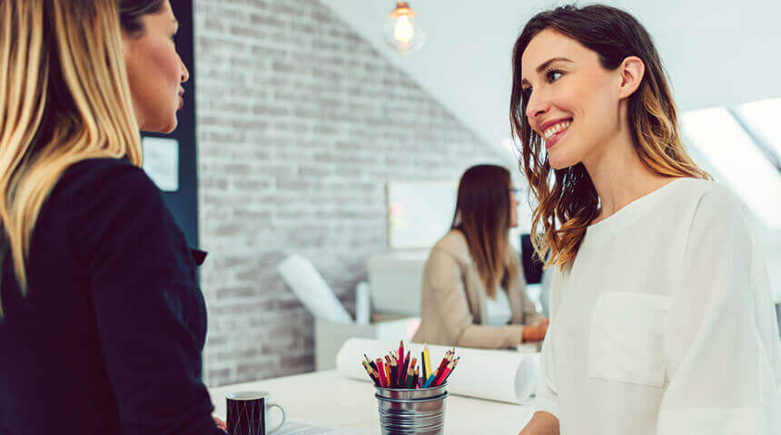 Two women working together