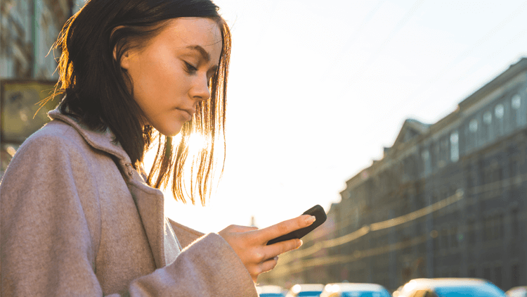 Concerned woman looking at phone