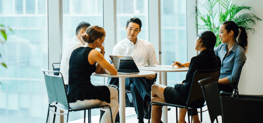 Team sitting at desk planning