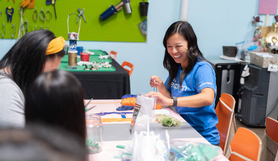 Experian employee volunteering her time by creating crafts  
