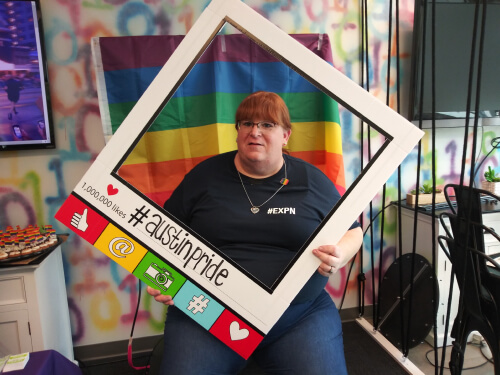 Leeza Martinez, an Experian employee posing with an Asian Pride cutout