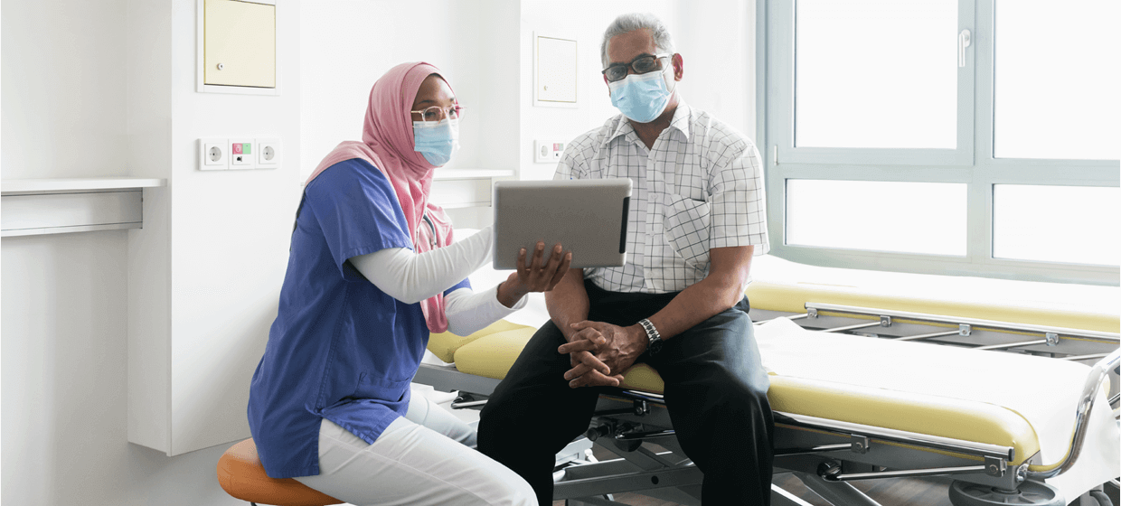 doctor and patient looking at chart together