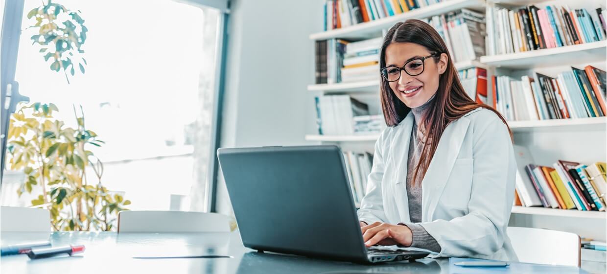 doctor looking at laptop