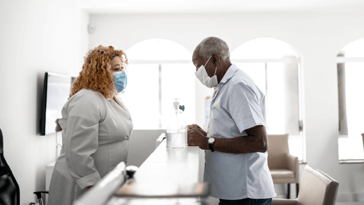 nurses looking at computer in hospital