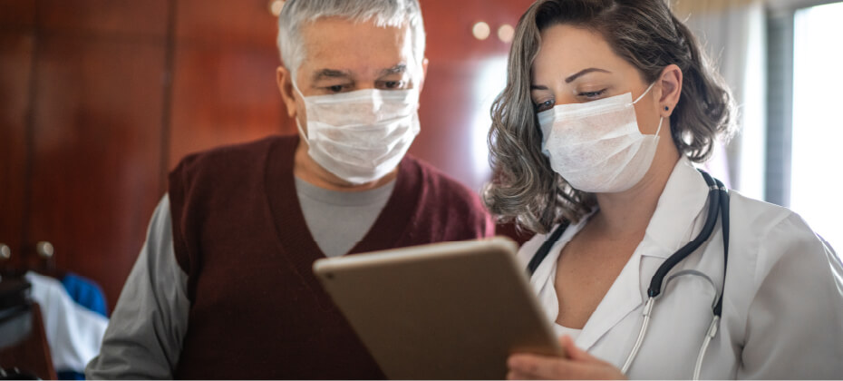 patient and doctor looking at tablet