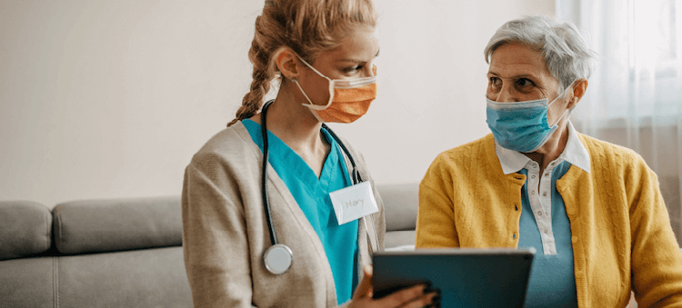 nurse and patient looking at tablet