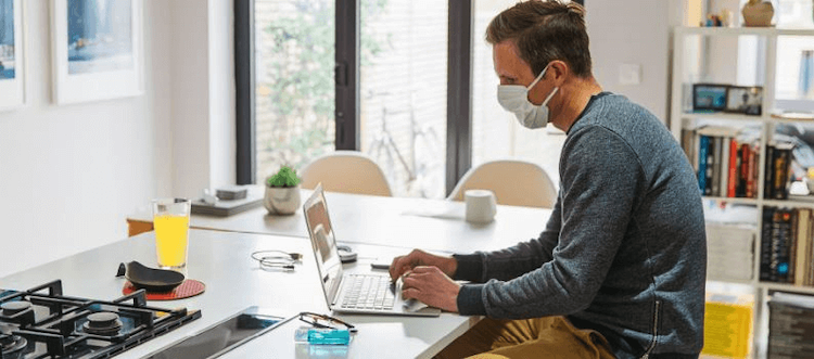 man wearing mask at island