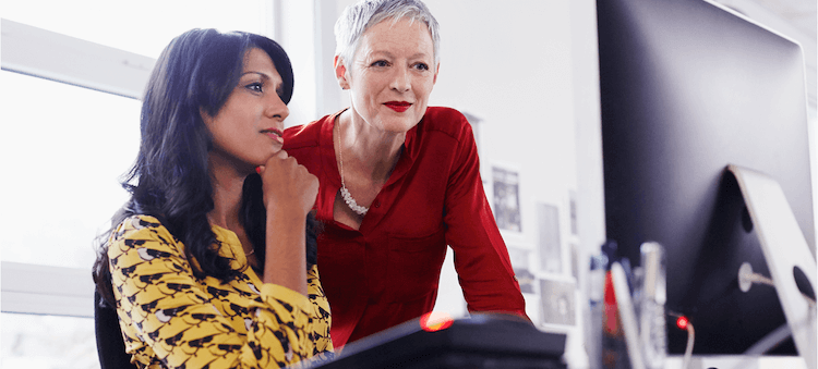 women looking at computer