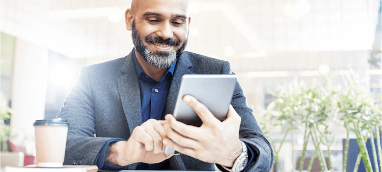 man looking at tablet