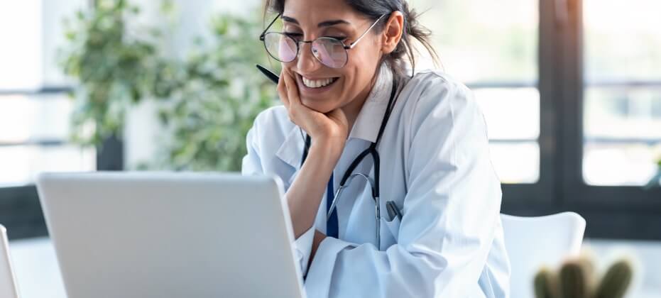 female doctor looking at computer